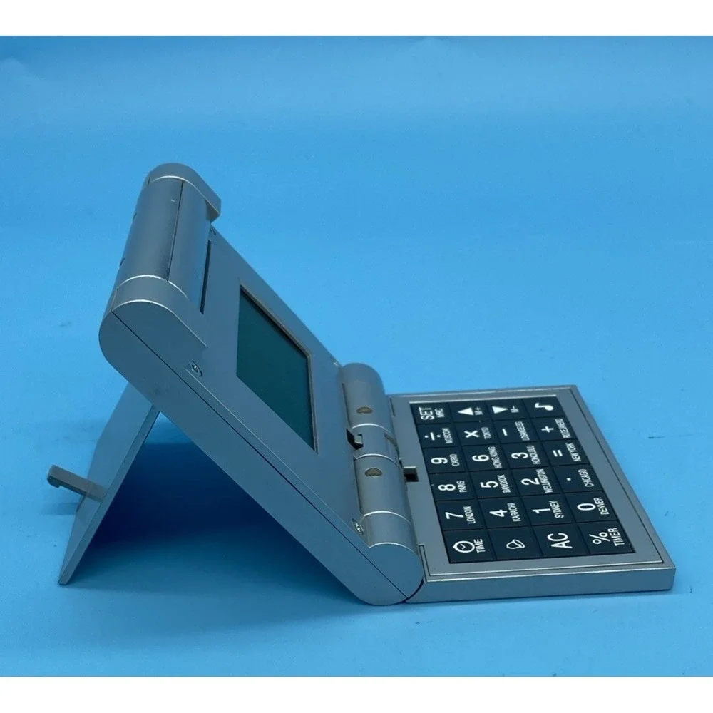 SunCoast World Time Travel Clock Calculator 2003 Silver Tested Works New Battery